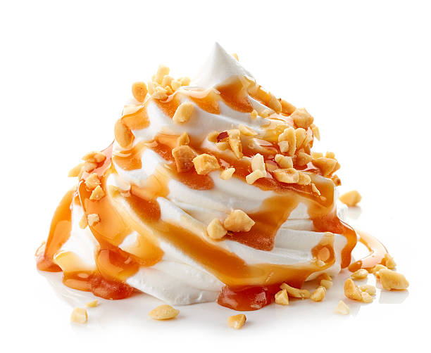 whipped cream with caramel sauce on white background whipped cream with caramel sauce and nuts isolated on white background dessert topping stock pictures, royalty-free photos & images