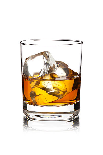 Whisky with Ice Cubes Whisky with Ice Cubes Isolated on White Background. rum stock pictures, royalty-free photos & images