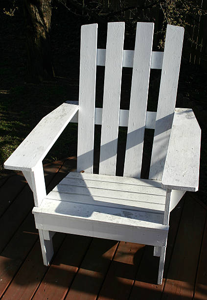 white adirondack chair stock photo