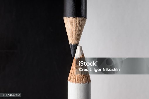 istock White and black pencils. Contrast and opposite concept 1327344803