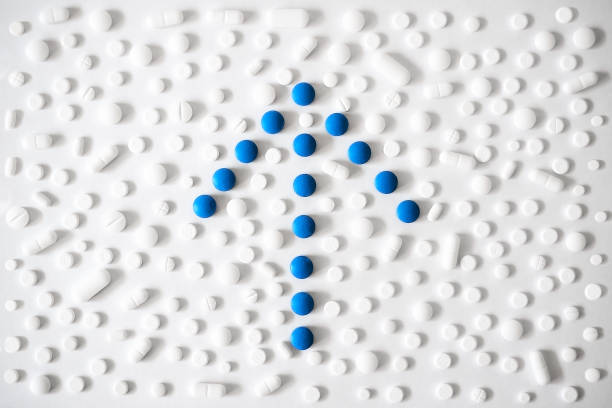 White and blue pills with arrow shape stock photo