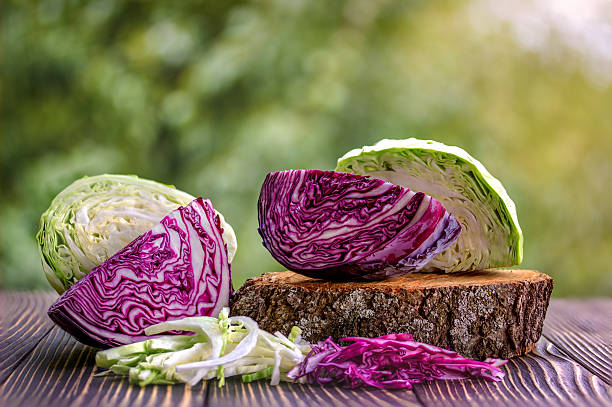 white and red cabbage and  chopped white and red cabbage white and red cabbage and  chopped white and red cabbage on wooden background cabbage stock pictures, royalty-free photos & images