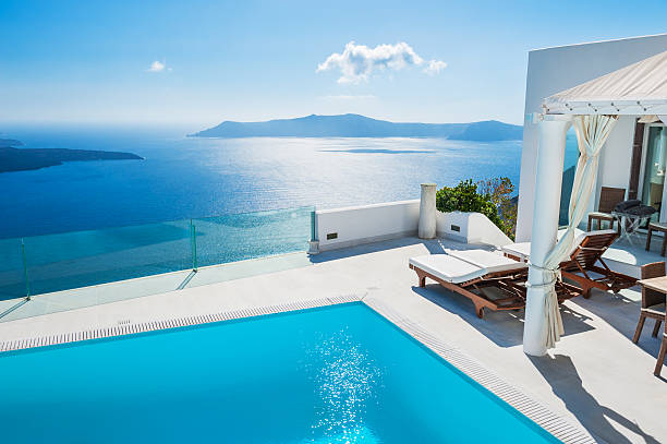 White architecture on Santorini island, Greece. White architecture on Santorini island, Greece. Swimming pool in luxury hotel. Beautiful landscape with sea view luxury hotel stock pictures, royalty-free photos & images