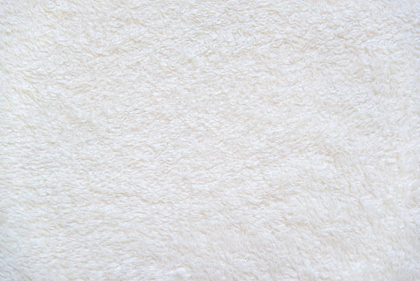 White background of plush fabric Beige background of plush fabric fluffy stock pictures, royalty-free photos & images