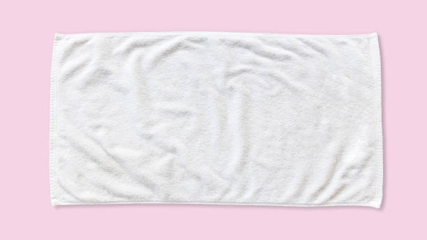 White beach towel mock up isolated with clipping path on pink background, flat lay top view White beach towel mock up isolated with clipping path on pink background, flat lay top view towel stock pictures, royalty-free photos & images