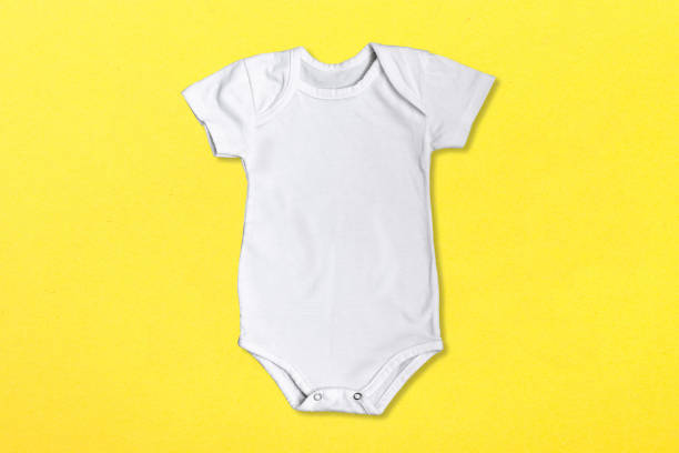 White bodysuit isolated on background. Accessories, clothes for newborns. Body of children . Delightful white jumpsuit. stock photo