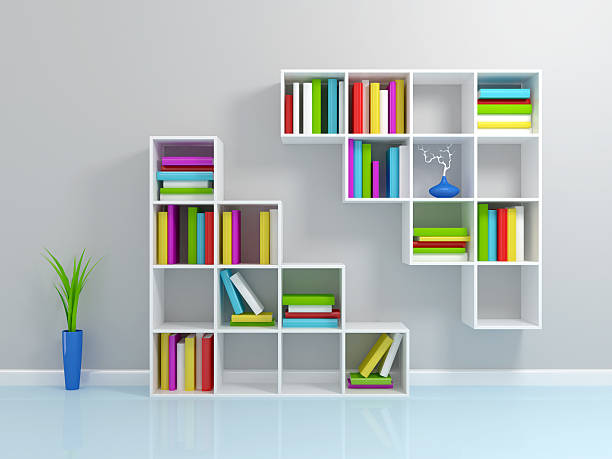 White bookshelf with a colorful books. stock photo