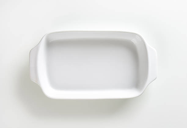 White ceramic baking dish Classic white ceramic baking dish with handles casserole dish stock pictures, royalty-free photos & images