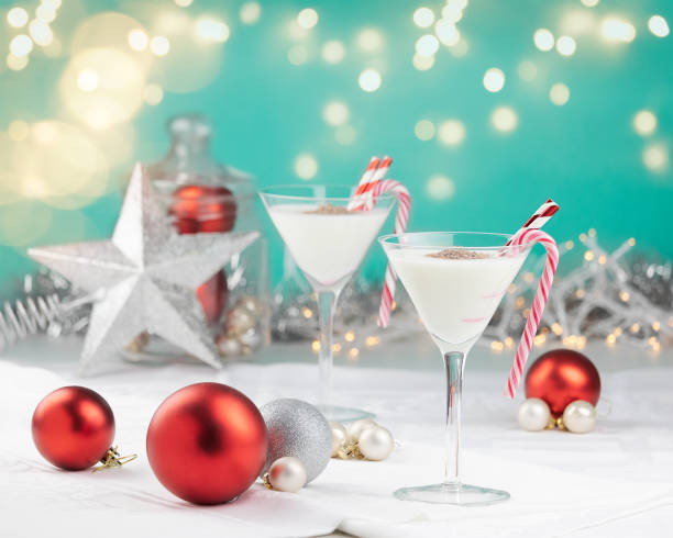 White Christmas cocktails in a colorful setting with sparkling lights stock photo