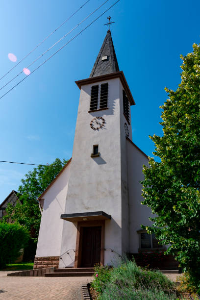 white church in Ingolsheim, France church in Ingolsheim, France bas rhin stock pictures, royalty-free photos & images