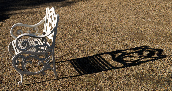 white colored baroque chair and shadow