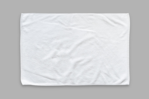 White cotton towel mock up template fabric wiper isolated on grey background with clipping path, flat lay top view