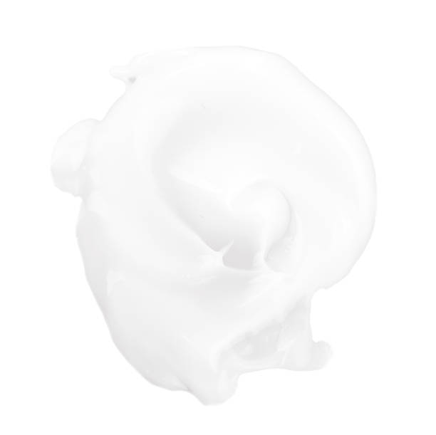 White cream foam splashed of white background stock photo