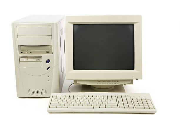 a white desktop computer with keyboard, tower and monitor - eski stok fotoğraflar ve resimler