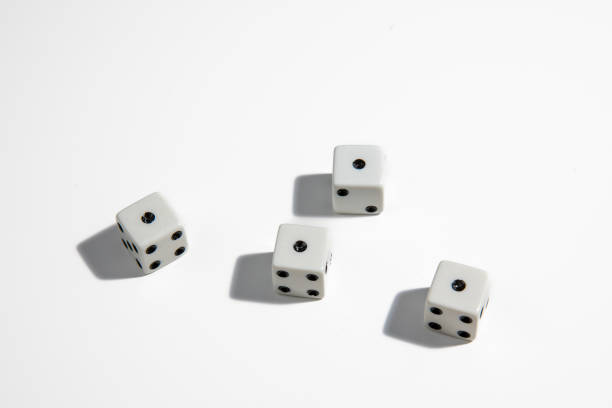 White dice with a one standing close to each other on a white background. Win or lose. Catch your luck. Gambling equipment. stock photo