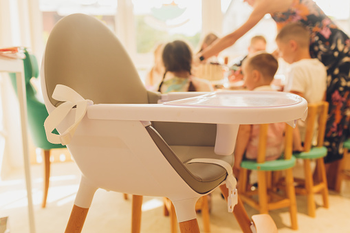 White dining chair for children. That has food stands Suitable for young children To make Baby a personal space to dine Diet training