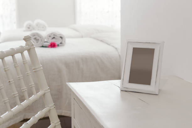 White dresser with an empty photo frame White dresser with an empty photo frame dresser photos stock pictures, royalty-free photos & images