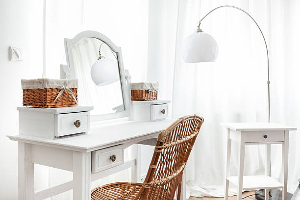 White dressing table with wicker elements stock photo