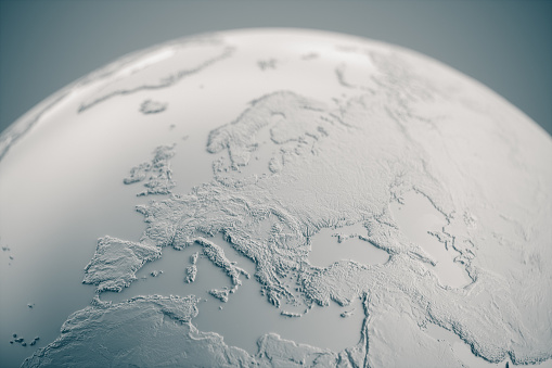 White embossed globe on gray background.\n(World Map Courtesy of NASA: https://visibleearth.nasa.gov/view.php?id=55167)