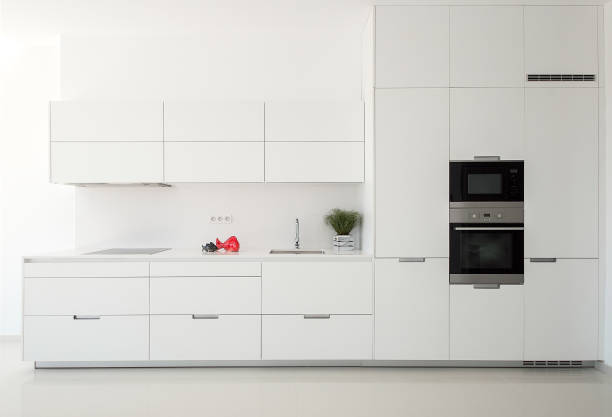 White empty classic kitchen in front view. Kitchen appliances. stock photo
