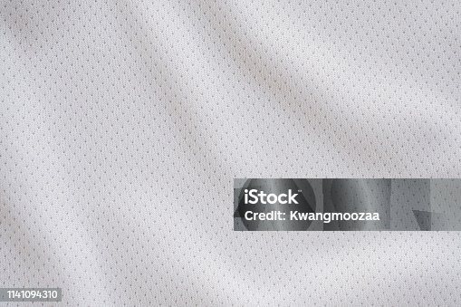 istock White fabric sport clothing football jersey with air mesh texture background 1141094310