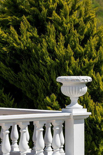 White Flower Pot And Balcony Railing In Terrace With View
