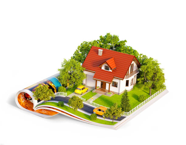 White house of dream with white fence, garden and trees on opened pages of magazine. stock photo