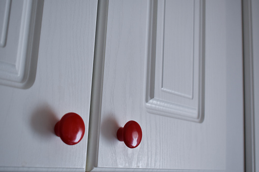 White Kitchen Cabinet With Red Knobs Stock Photo Download Image