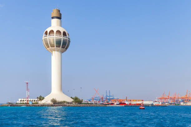 White lighthouse and traffic control tower. Jeddah, Saudi Arabia stock photo