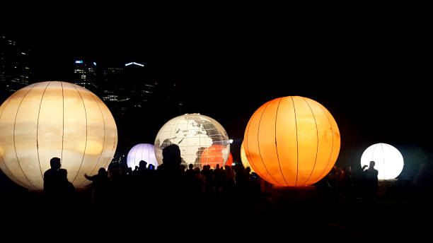 White Night Festival - Melbourne Melbourne, Australia: February 18, 2018: Silhouetted people enjoying colourful lanterns in Melbourne's annual White Night art, music and culture festival. Over 500,000 people attended the free event. federation square stock pictures, royalty-free photos & images