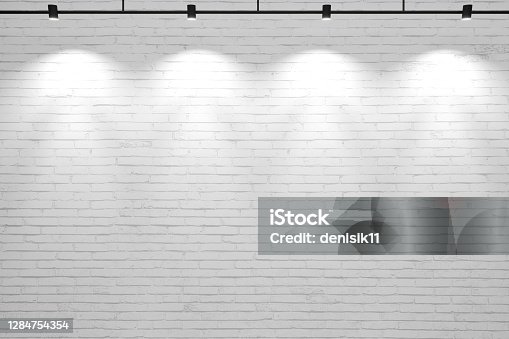 istock White old brick wall background with lamps 1284754354
