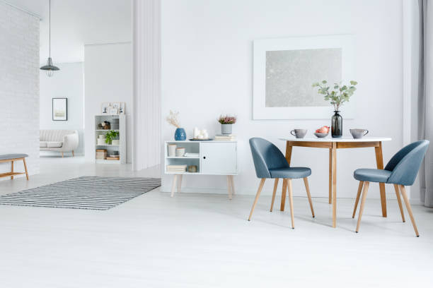White open space apartment White open space apartment - dining and living room interior with modern design furniture and elegant decorations scandinavian culture photos stock pictures, royalty-free photos & images