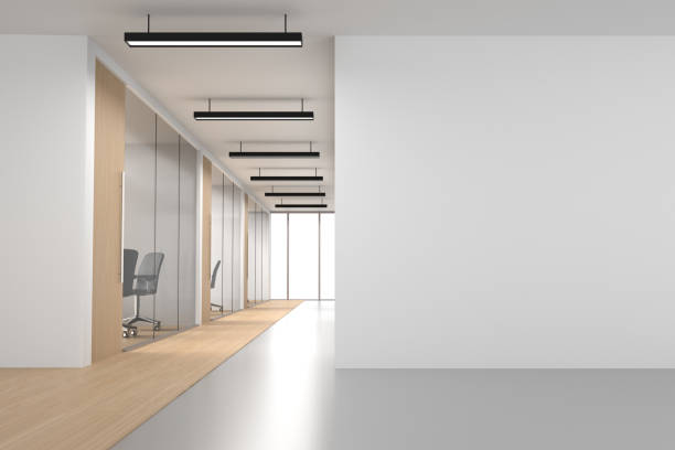 ufficio open space bianco con muro vuoto e finestre bianche - corridoio ufficio foto e immagini stock