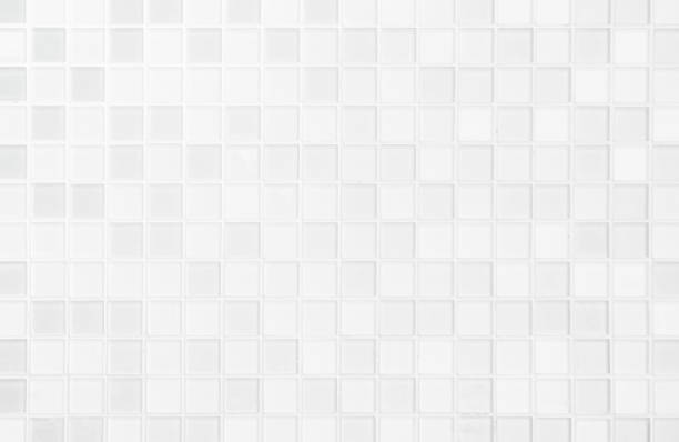 White or gray ceramic wall and floor tiles abstract background. White or gray ceramic wall and floor tiles abstract background. Design geometric mosaic texture for the decoration of the bedroom. Simple seamless pattern for backdrop advertising banner poster or web tiled floor photos stock pictures, royalty-free photos & images