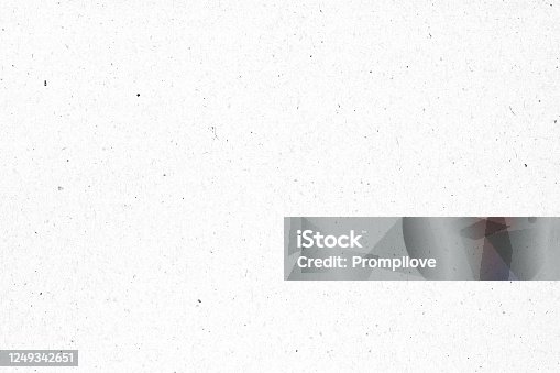 istock White paper or cardboard texture with black spot background. 1249342651