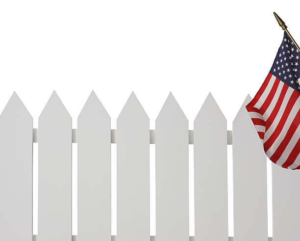 White Picket Fence with American Flag stock photo