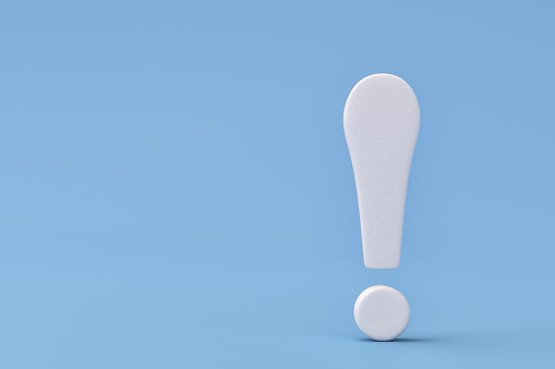 White Plaster Exclamation Point On Blue Background