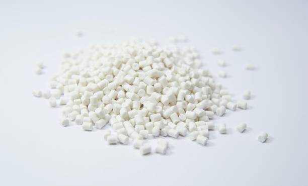 White plastic polymer granules White Thermoplastic compounds used as raw material in plastic industry granule stock pictures, royalty-free photos & images
