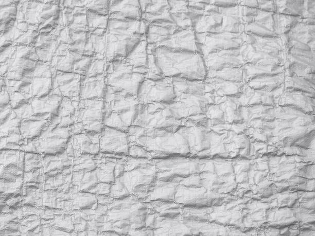 White plastic wrinkled texture. Abstract texture, plastic bag for background White plastic wrinkled texture. Abstract texture, plastic bag for background knobby knees stock pictures, royalty-free photos & images
