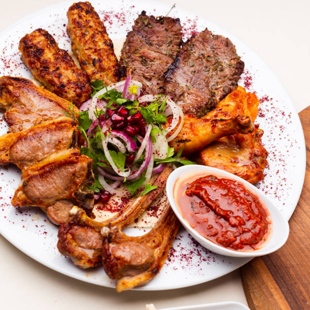 White plate with different types of meat prepared on the grill by special Turkish recipe. stock photo