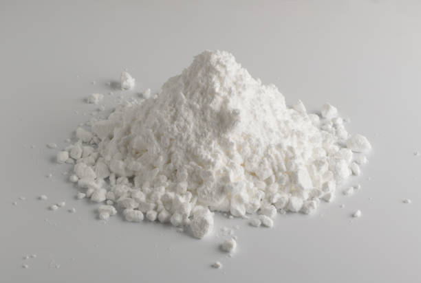 White Powder of Gypsum, Clay or Diatomite Isolated on Grey Background White Powder of Gypsum, Clay or Diatomite Isolated on Grey Background. Macro Photo of Powdered Chemicals as Calcium, Gypsum or Plaster Close Up glucosamine stock pictures, royalty-free photos & images