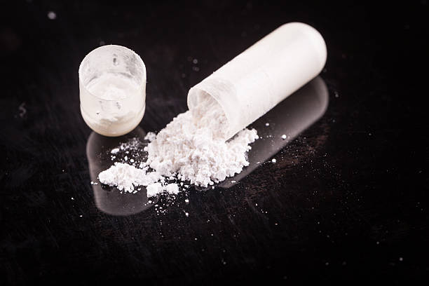 white powder white powder on black surface amphetamine stock pictures, royalty-free photos & images