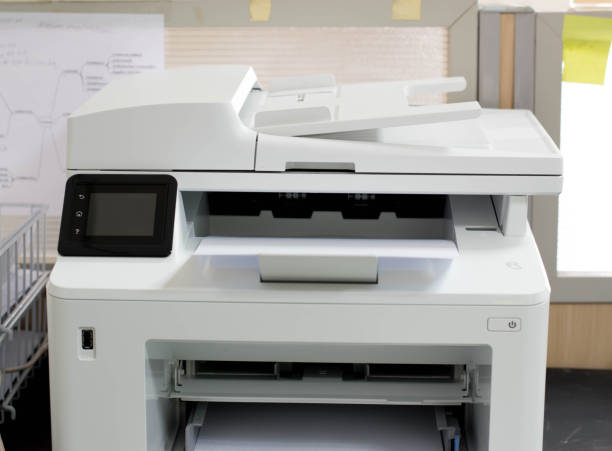 White printer and paper laser printer. White printer and paper laser printer. oficina stock pictures, royalty-free photos & images