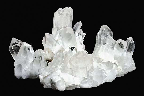 White quartz crystals on a black background  Quartz Crystals quartz stock pictures, royalty-free photos & images