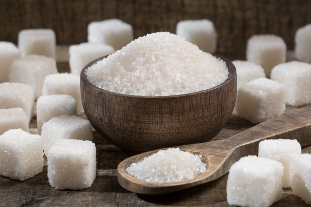 White refined sugar powder and cubes stock photo