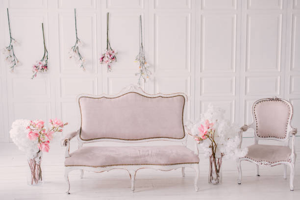 White room with vintage interior and spring flowers stock photo