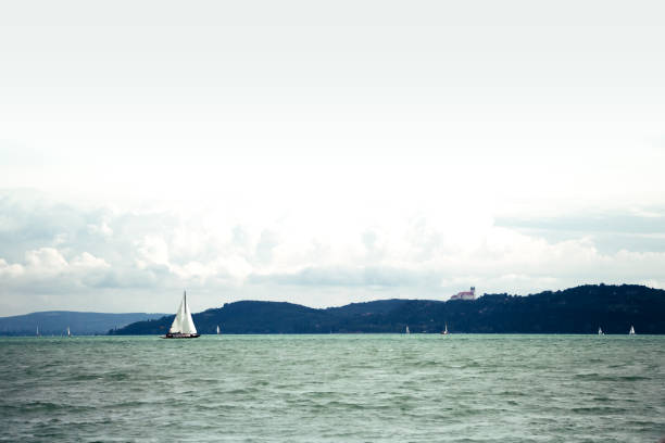 White sailboat on a cloudy day at the Lake Balaton stock photo