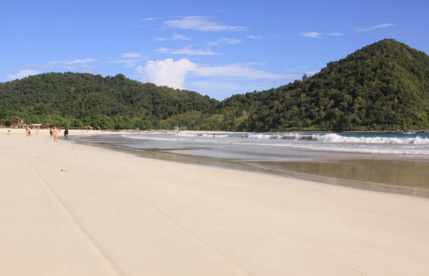 White sand and waves at Mawun beach Lombok stock photo