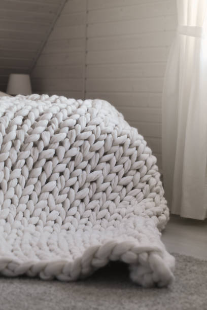 White scandinavian interior with knit plaid. stock photo