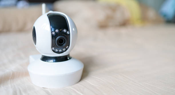 white security camera with wifi has installed on the bed stock photo